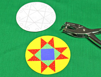 Paper Quilt Patch Ornament step 8 use pattern for holes