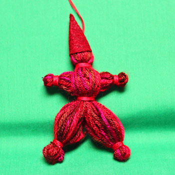 Yarn Elf Ornament red on display