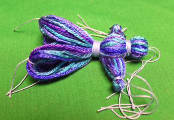Yarn Elf Ornament step 14 wrap small yarn to form torso