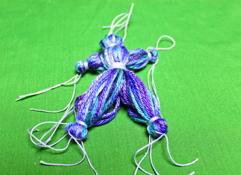 Yarn Elf Ornament step 15 wrap and tie yarn around legs