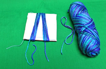 Yarn Elf Ornament step 3 wrap large yarn 40 times around stiff card