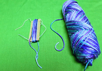 Yarn Elf Ornament step 9 wrap large yarn around small stiff card