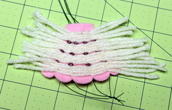 Yarn and Felt Scallop Ornament step 14 wrap last 4 yarns