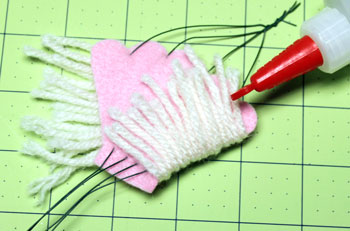 Yarn and Felt Scallop Ornament step 15 glue yarns to back